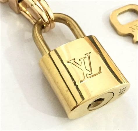 how to spot an authentic louis vuitton padlock|Louis Vuitton padlock necklace.